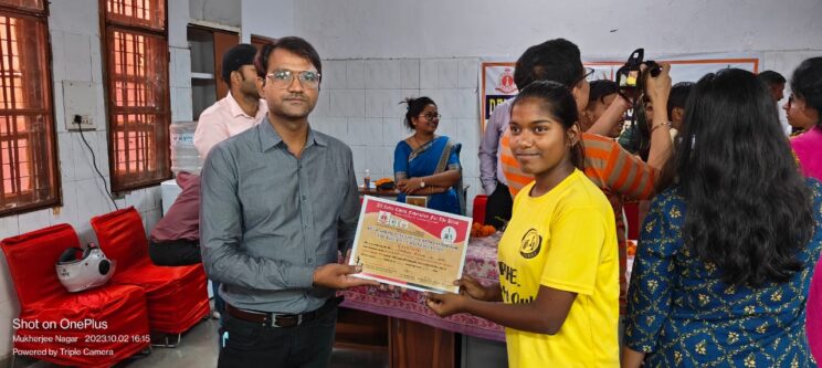 Anupama is being awarded with the certificate